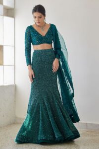 Bottle green fish-cut lehenga with sequin shine and long-sleeve blouse – Ethnora