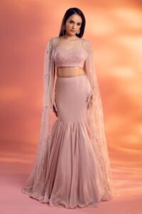 Peach pastel fish-cut lehenga with embellished blouse and cape dupatta – Ethnora
