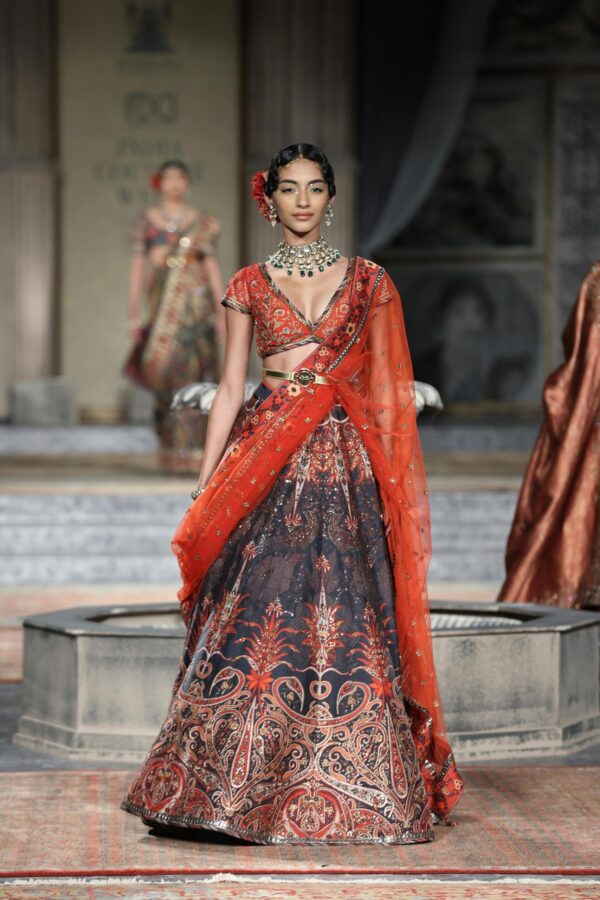 Fiery Saffron Couture Lehenga with Deep V-Cut Blouse​